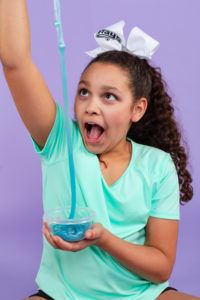 slime, purple, teal aqua, turquoise, pink, squishies, squishy's, bows, cheerleader, curly hair, orange, white bow, turquoise shirt, tween girl, 11 years old, fun, silly