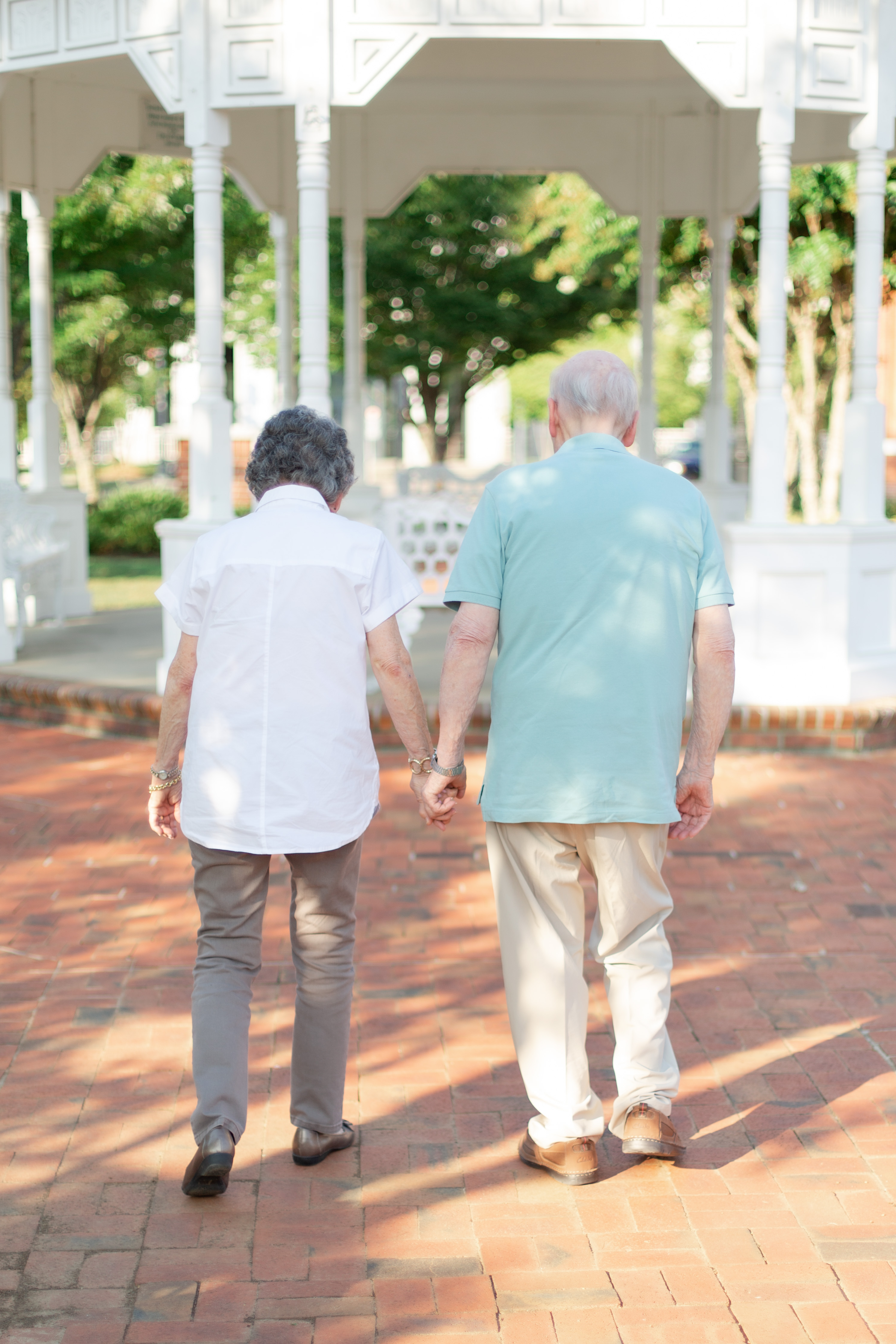 59th wedding anniversary couple walks hand in hand in downtown Canton
